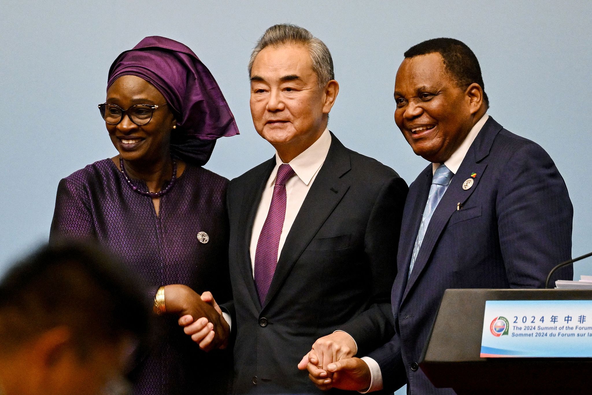 Chinese Foreign Minister Wang Yi (C) shakes hands with Senegal's Foreign Minister Yacine Fall (L) and Minister of Foreign Affairs of the Republic of Congo Jean-Claude Gakosso at a press conference during the 2024 Summit of the FOCAC in Beijing, China, September 5, 2024. /CFP