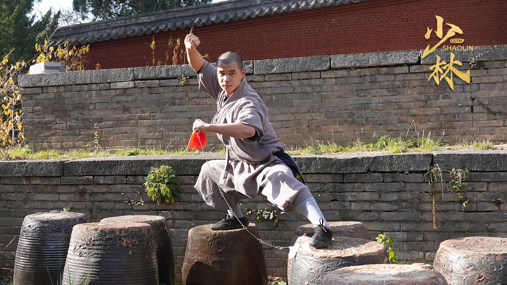 Shi Yanxiang performs the classic moves of Shaolin's nine section chain whip technique, Shaolin Temple, central China's Henan Province, 2024. /CGTN