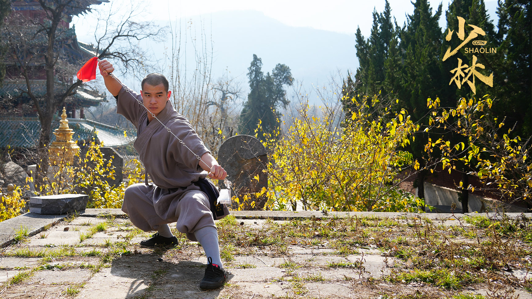 Shi Yanxiang performs the classic moves of Shaolin's nine section chain whip technique, Shaolin Temple, central China's Henan Province, 2024. /CGTN