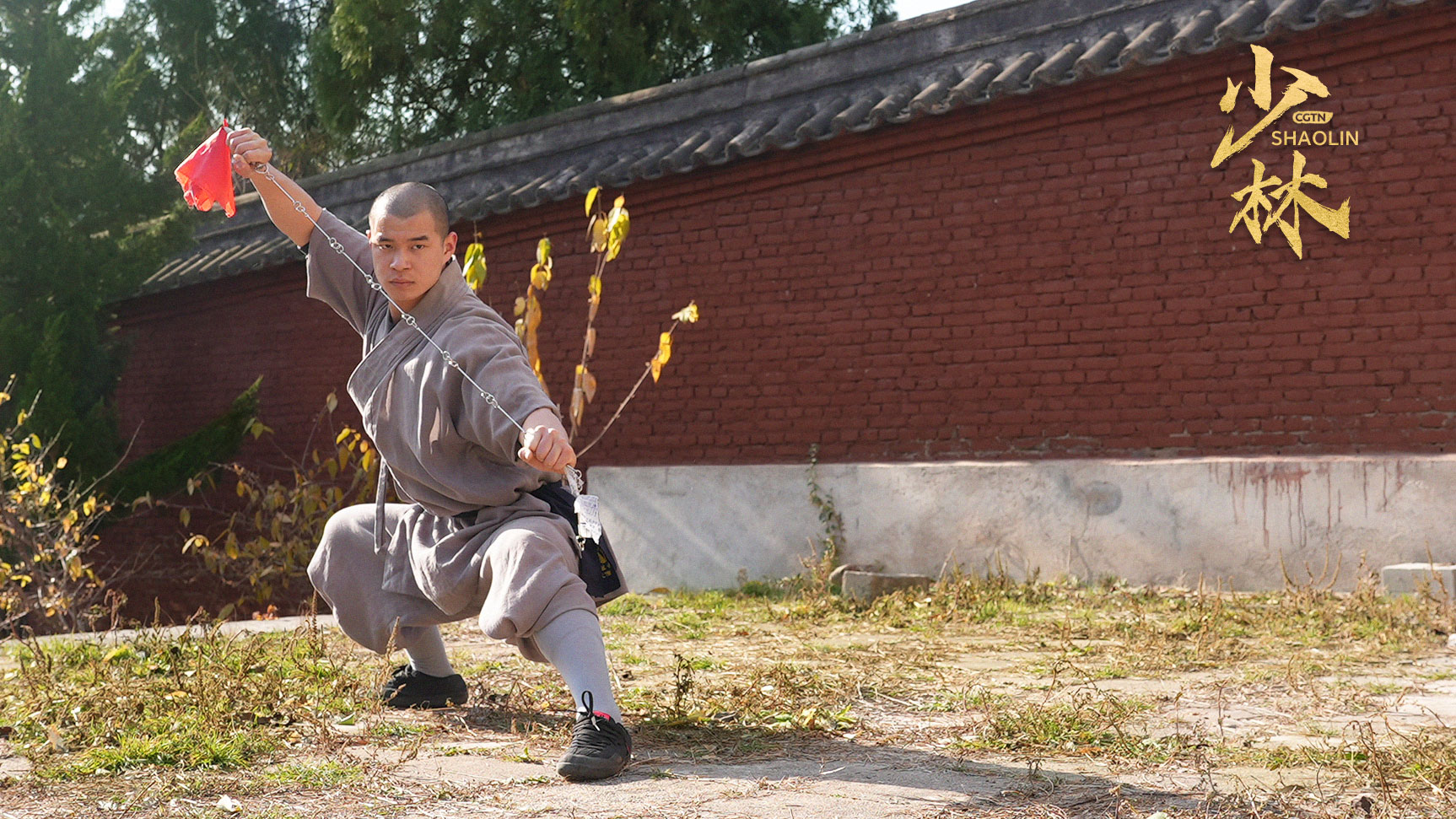 Shi Yanxiang performs the classic moves of Shaolin's nine section chain whip technique, Shaolin Temple, central China's Henan Province, 2024. /CGTN