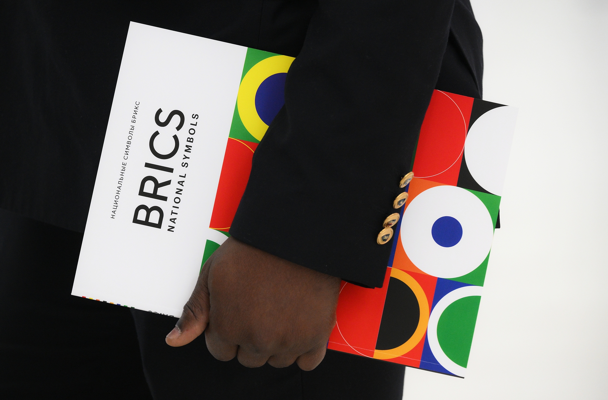 A media worker holds a booklet of BRICS during the 16th BRICS Summit in Kazan, Russia, October 23, 2024. /CFP