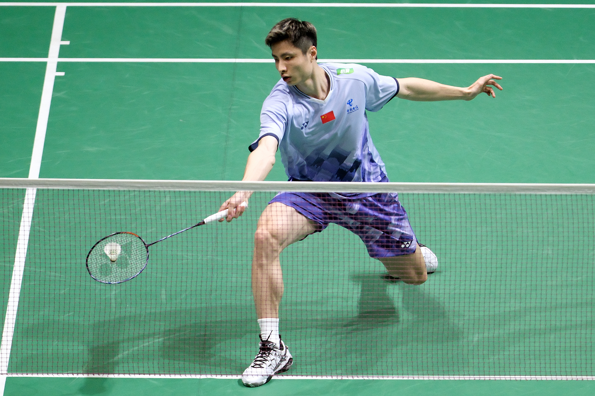 Shi Yuqi of China hits a shot in the men's singles match against Kenta Nishimoto at the Malaysia Open in Kuala Lumpur, Malaysia, January 7, 2025. /CFP