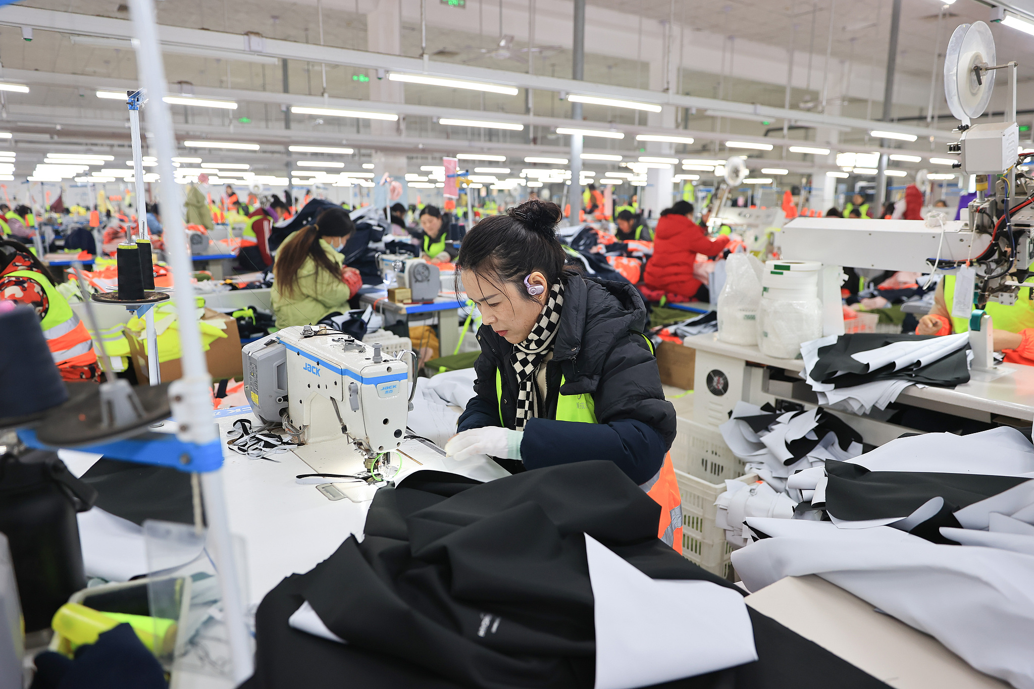 Workers at a garment export company produce clothing for overseas markets in Jinshan Town, Ganyu District, Lianyungang City, Jiangsu Province, China, January 8, 2025. /CFP