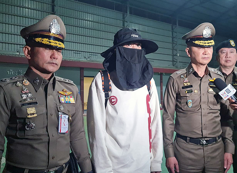 A handout photo made available by the Royal Thai Police shows Chinese actor Wang Xing (C) being escorted by Thai police officers after returning from Myanmar, at the police airport in Bangkok, Thailand, January 7, 2025. /CFP