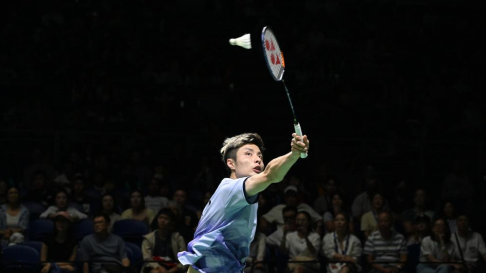 China's Shi Yuqi hits a shot in his three-game win over Chinese Taipei's Chou Tien-chen to reach the men's singles semifinals at the BWF Malaysia Open in Kuala Lumpur, Malaysia, January 10, 2024. /Xinhua