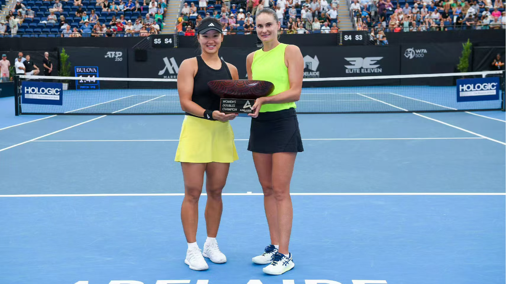 Guo Hanyu (L) and Alexandra Panova pose with the trophy after winning the women's doubles title at the WTA Adelaide International in Adelaide, Australia, January 10, 2024. /CFP