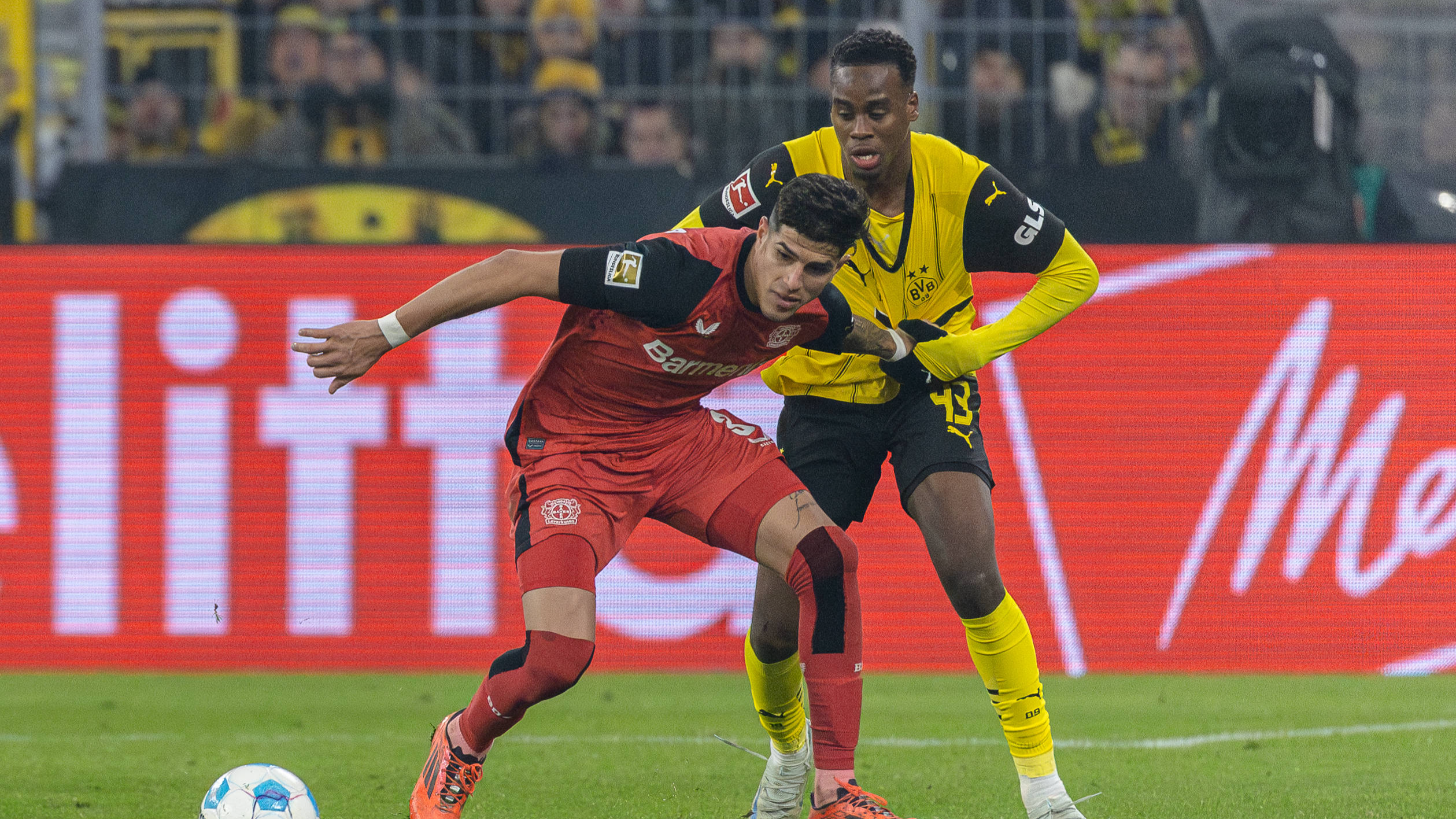 Players from Bayer Leverkusen and Borussia Dortmund face off in a German Bundesliga match in Dortmund, Germany, January 10, 2024. /CFP 