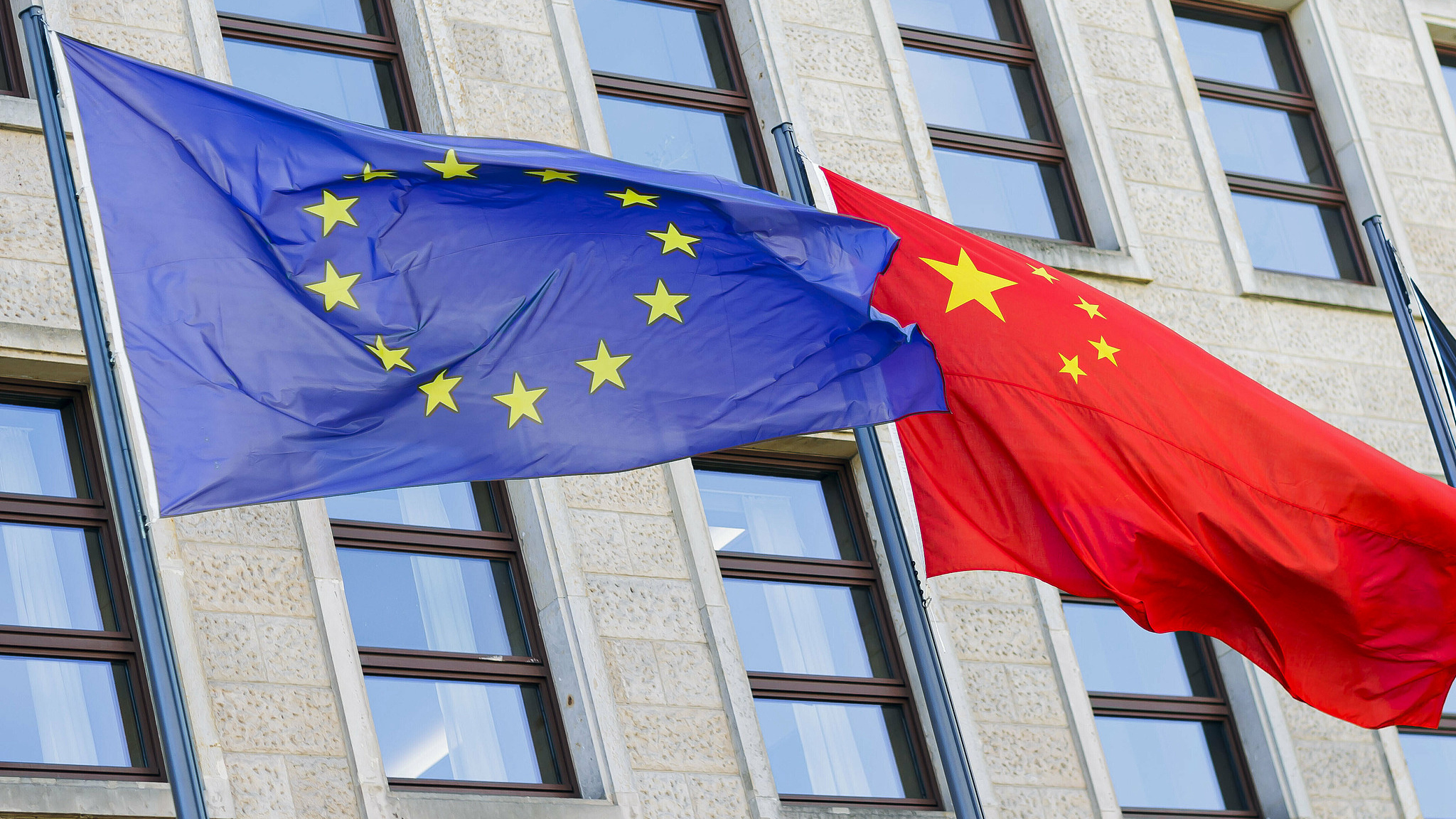 File photo of the flags of the European Union and China. /CFP