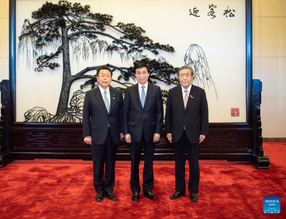 Wang Huning (C), a member of the Standing Committee of the Political Bureau of the CPC Central Committee and chairman of the National Committee of the CPPCC, meets with a delegation of Japan's ruling coalition, led by Secretary General Hiroshi Moriyama (R) of the Liberal Democratic Party and Secretary General Makoto Nishida of the Komeito Party, in Beijing, capital of China, January 14, 2025. /Xinhua