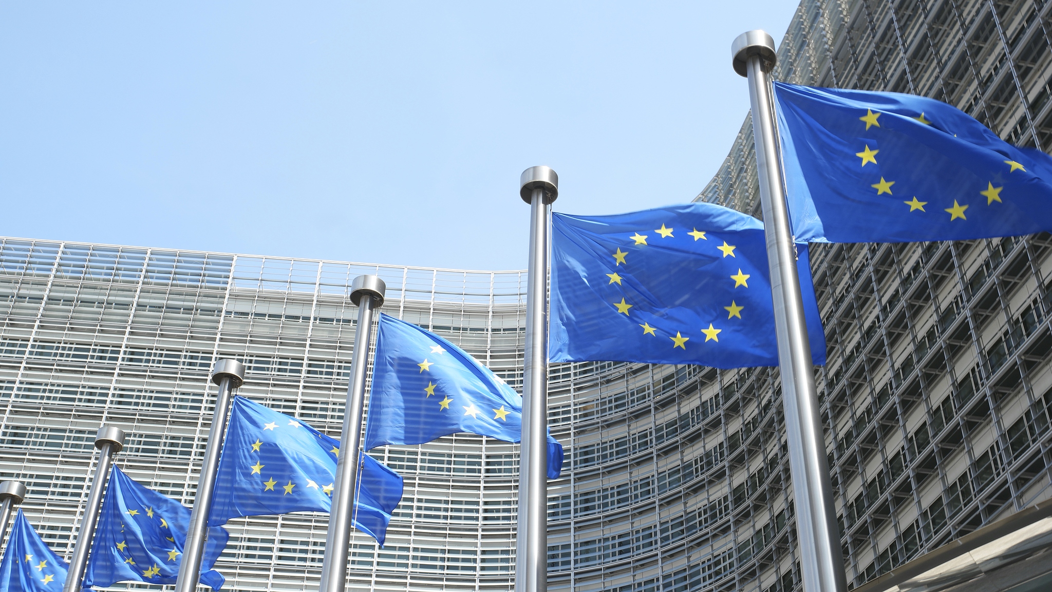 EU flags flutter in front of the Berlaymont building, headquarters of the European Commission in Brussels, Belgium. /CFP