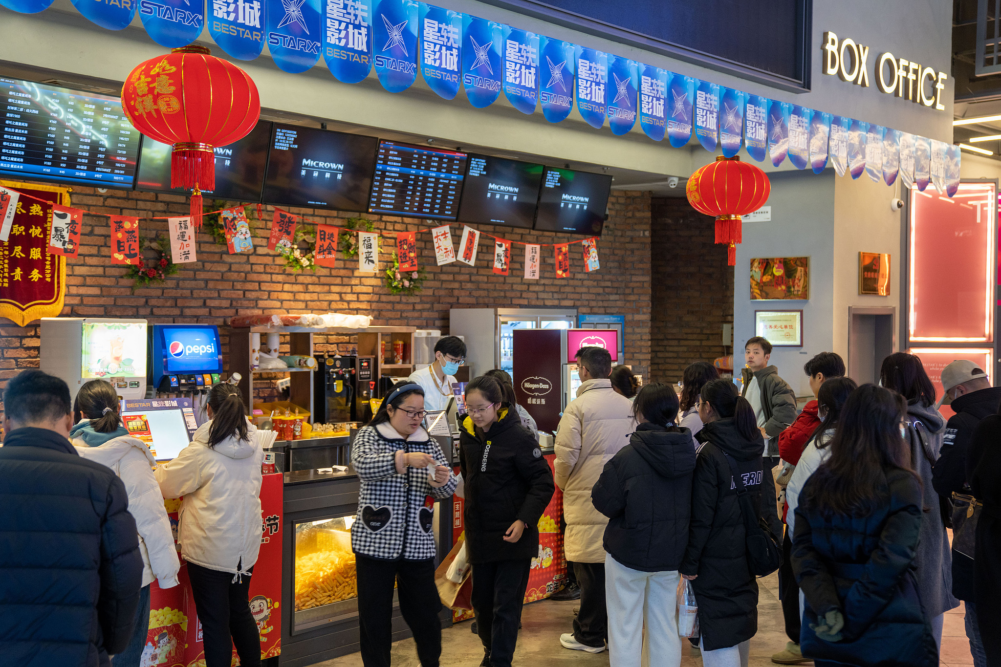 People queue up to buy movie tickets in Hefei City, east China