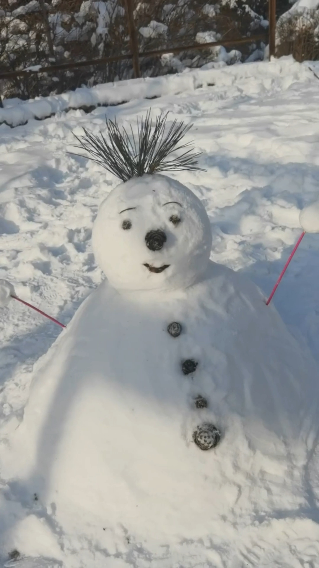 Kids build snowmen in support of the Asian Winter Games