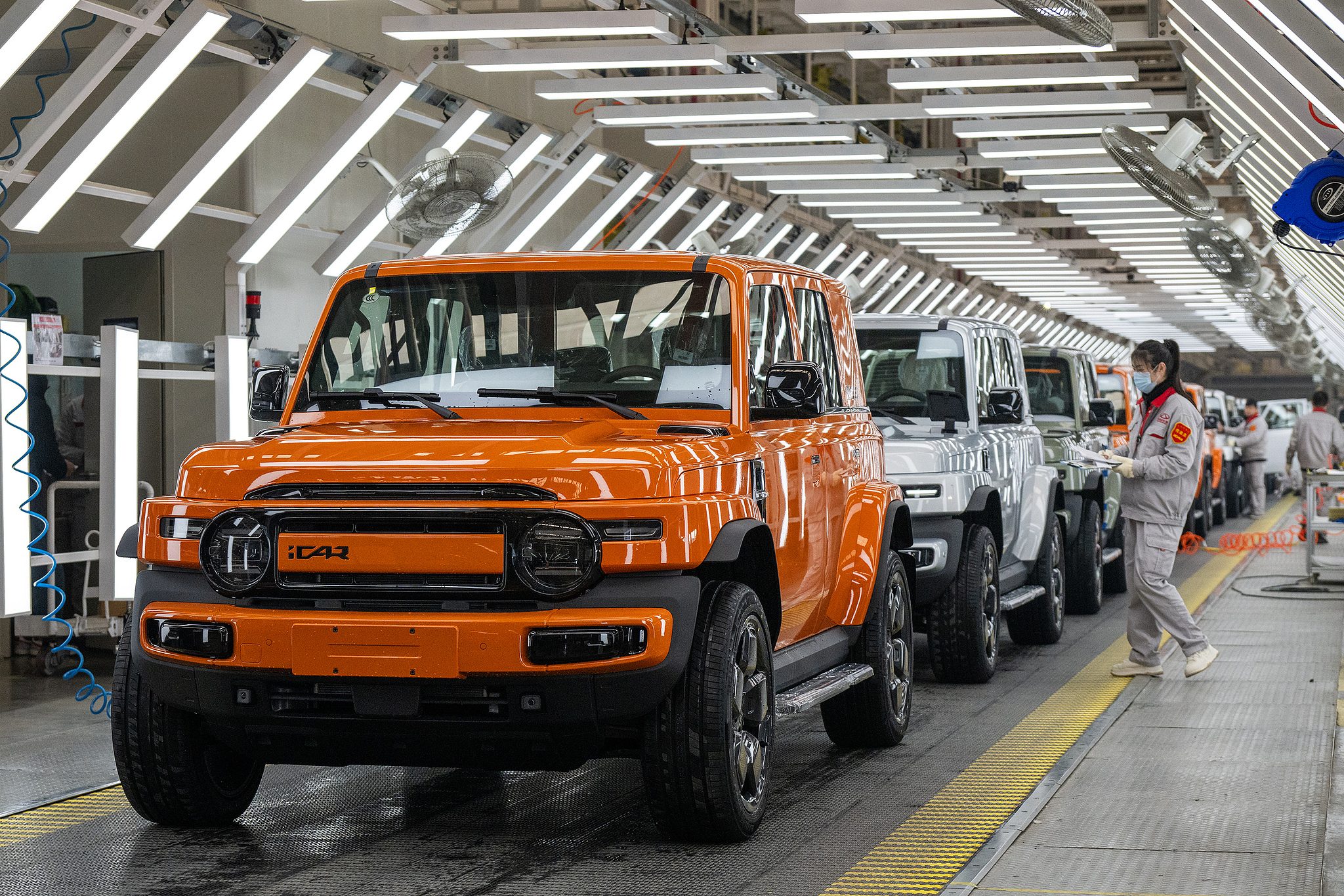 Workers are inspecting new energy vehicles in a workshop in Wuhu, Anhui Province on January 3, 2025. /VCG
