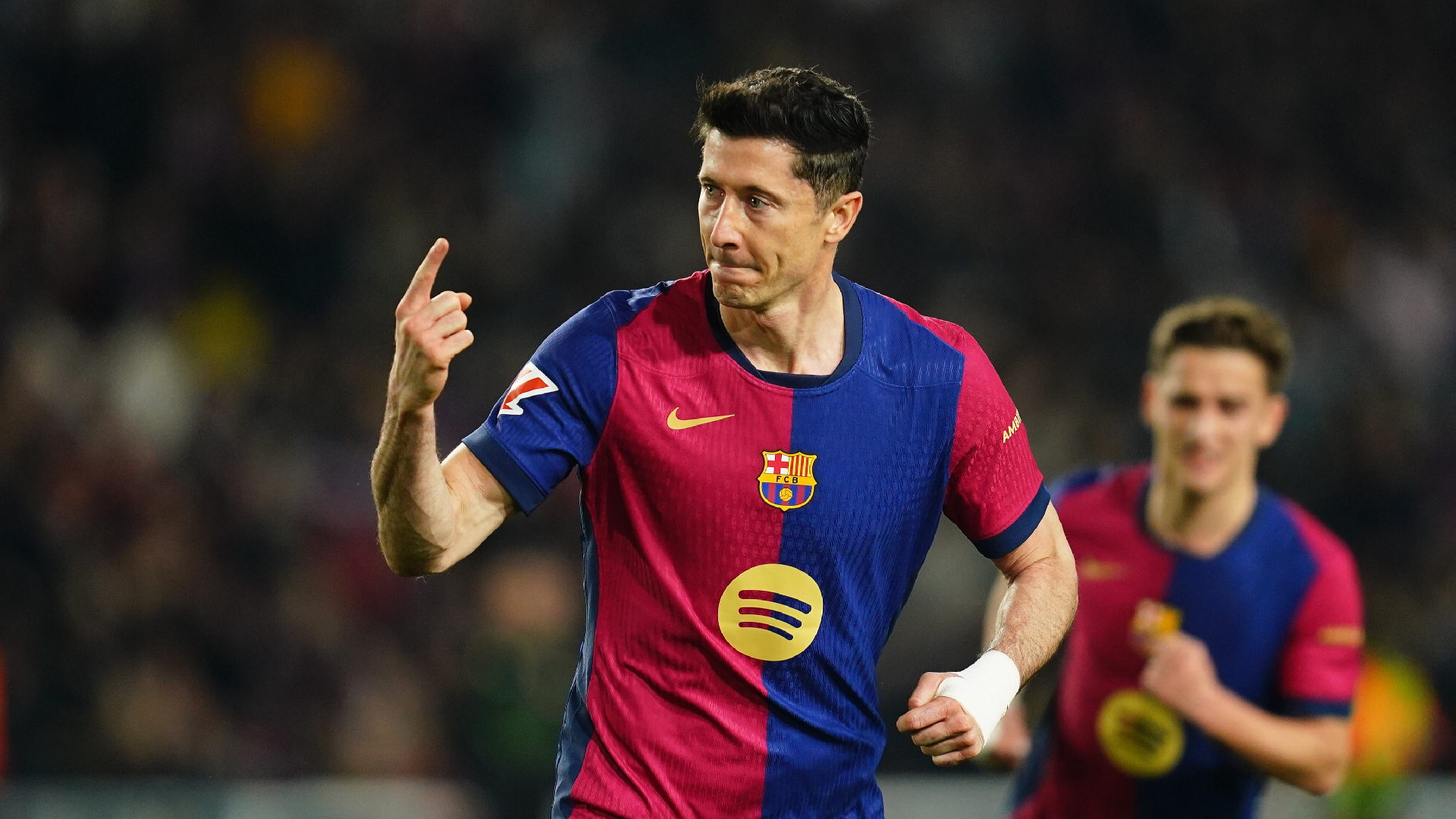 Barcelona edge Rayo Vallecano to claim top spot on Lewandowski penalty