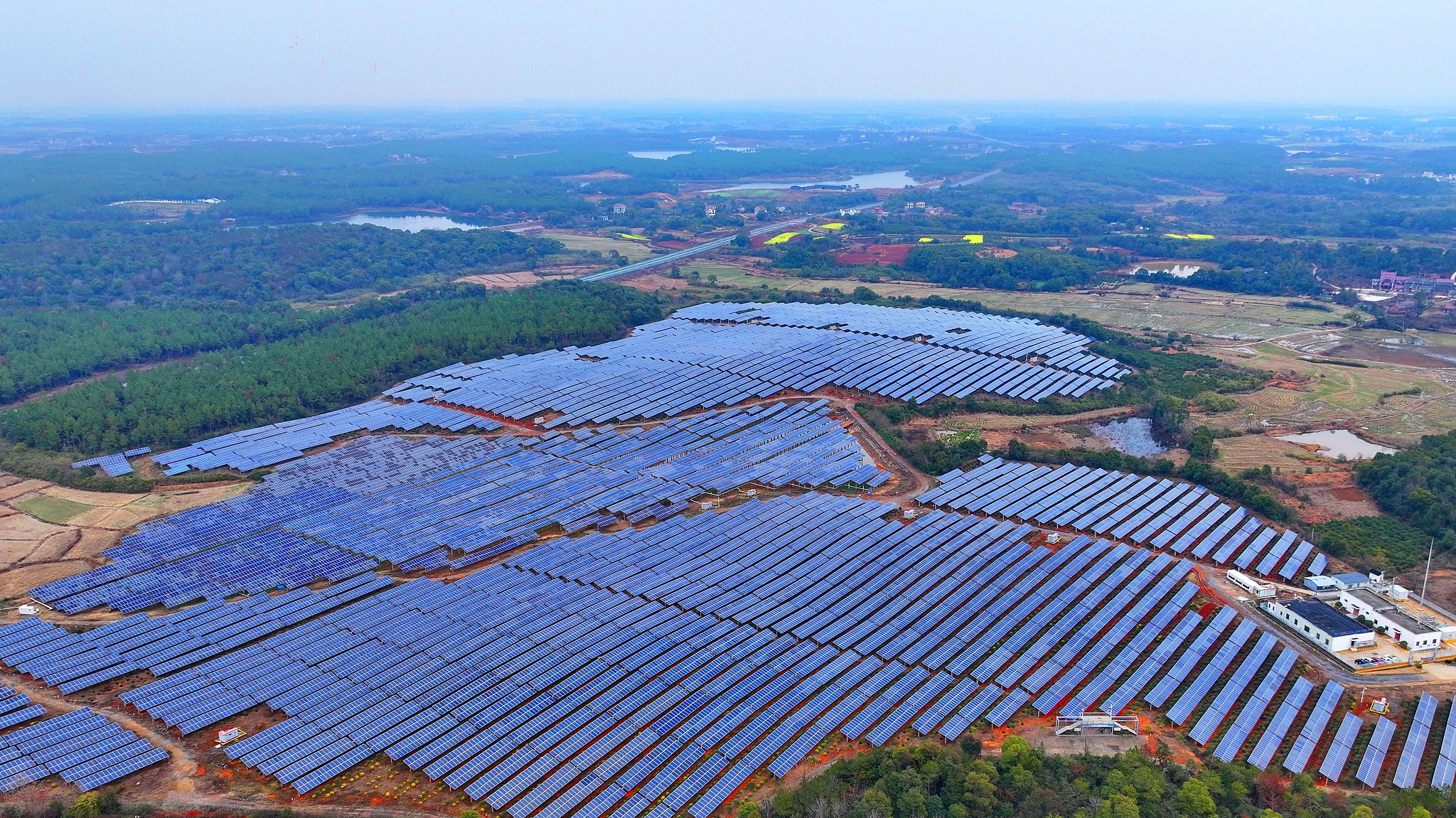 Rows of photovoltaic panels in Yichun, Jiangxi Province, are lined up in sequence, continuously generating clean electricity, February 20, 2025. /CFP