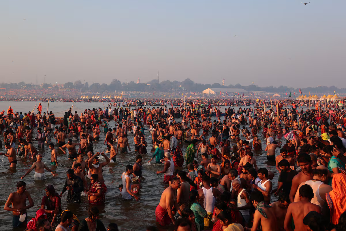 Devotees take a dip at Sangam, the confluence of the Ganges and Yamuna rivers with the mythical, invisible Saraswati River, to mark one of the auspicious days during the Maha Kumbh Mela,