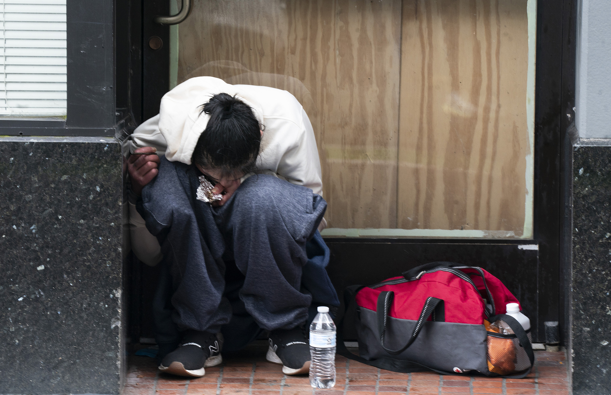 A person smokes fentanyl in downtown Portland, Oregon, United States, April 12, 2023. /CFP