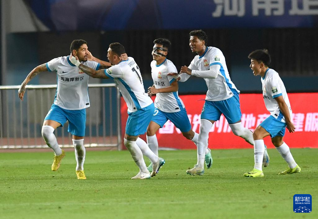 Players of Qingdao West Coast celebrate after scoring a goal in the Chinese Super League (CSL) game against Henan in Zhengzhou, central China's Henan Province, April 1, 2025. /Xinhua