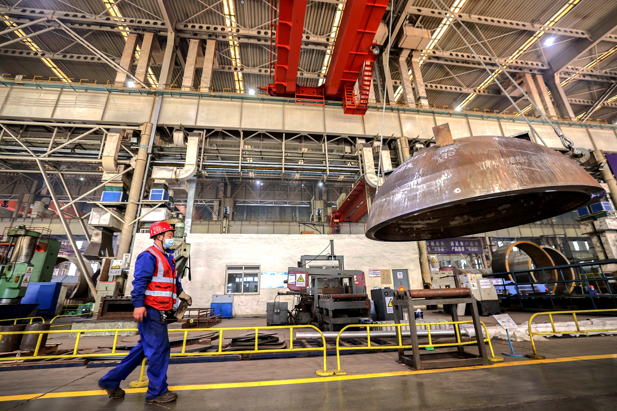 An employee carrying out a visual inspection of a large pressure vessel product at a factory in Qingdao, Shandong Province, October 31, 2024. /CFP