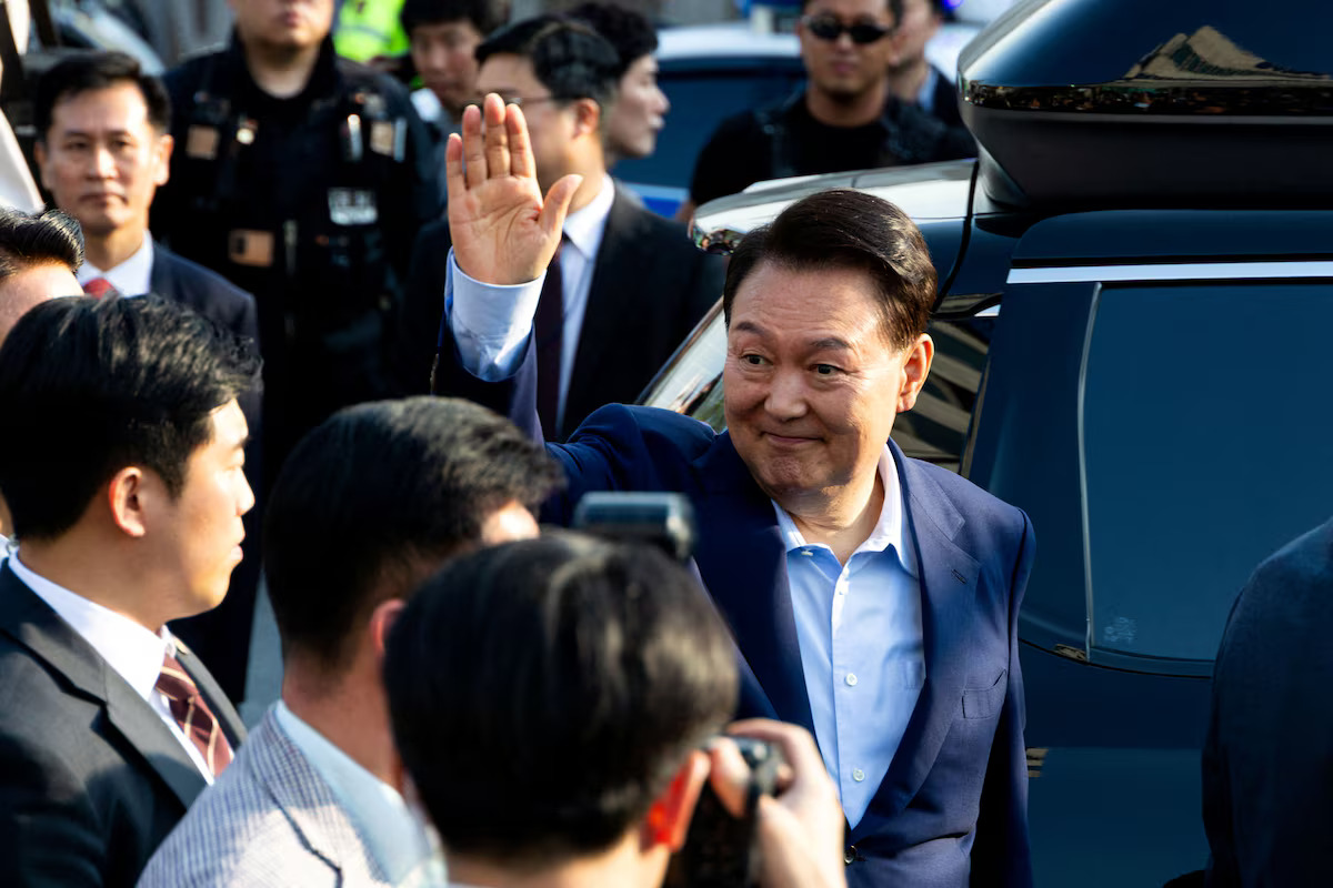 Ousted former South Korean President Yoon Seok-yeol waves to supporters as he moves out of the presidential residence in Seoul, South Korea, April 11, 2025. /Reuters