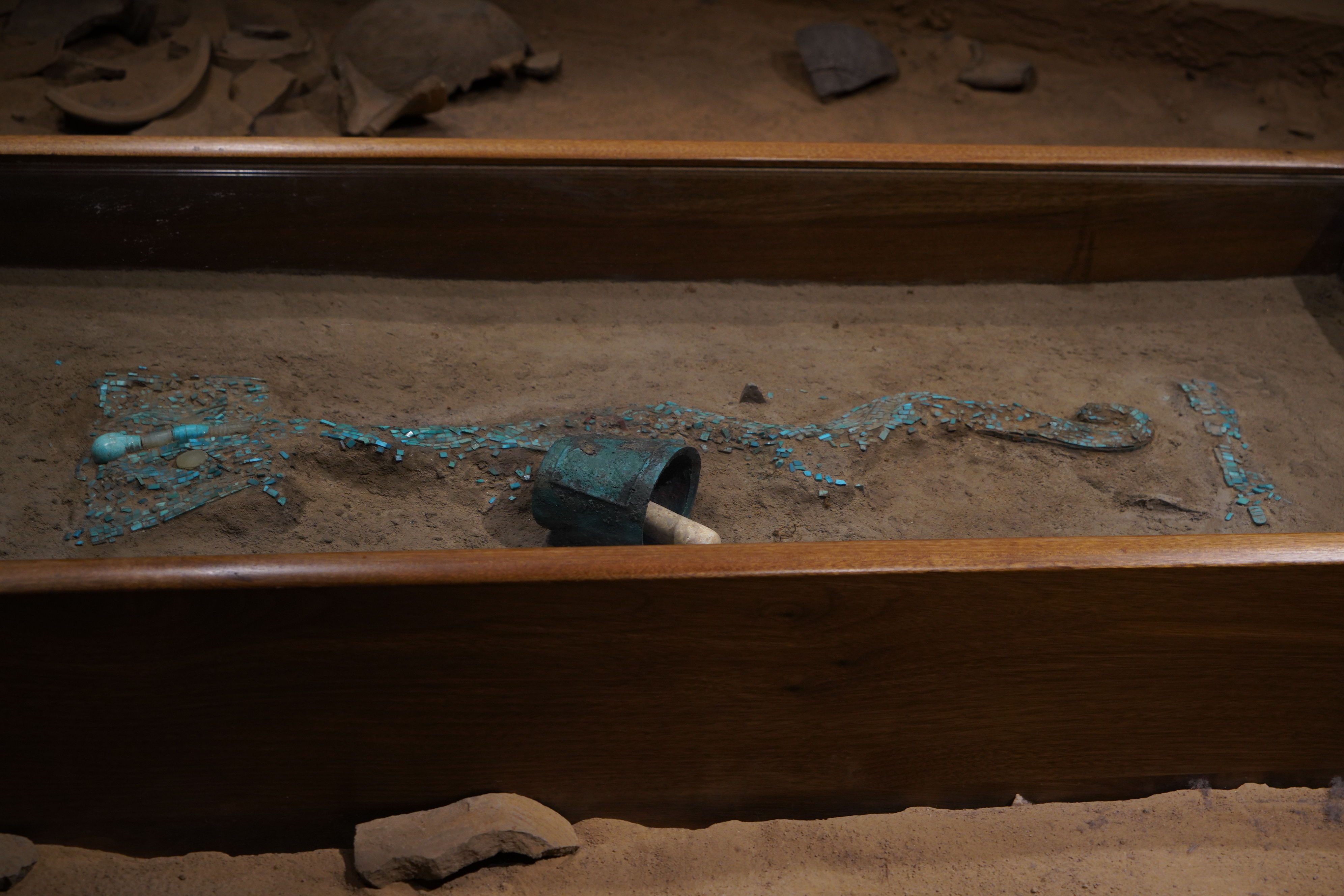 A replica of a dragon-shaped object inlaid with turquoise is displayed at the Erlitou Site Museum of the Xia Capital in Luoyang, Henan Province, on April 22, 2025. /CGTN