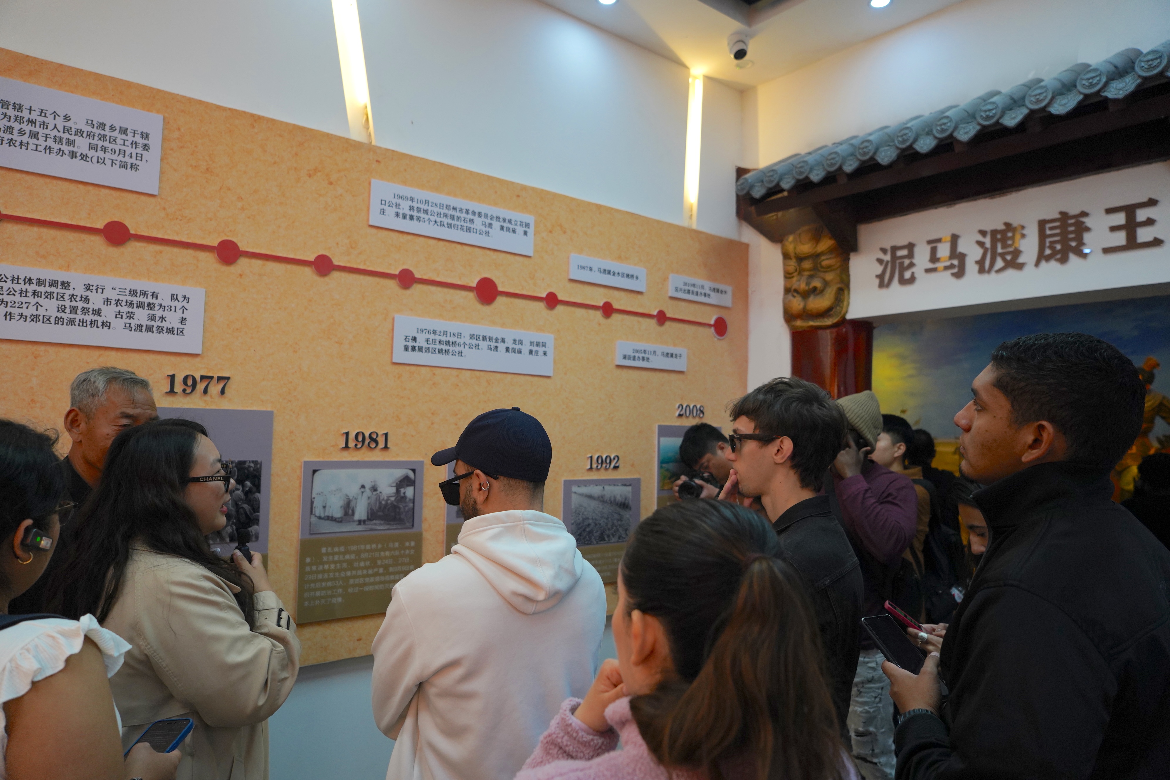 A media delegation from Latin America and the Caribbean learns about the history of Madu Village during the CGTN-led 