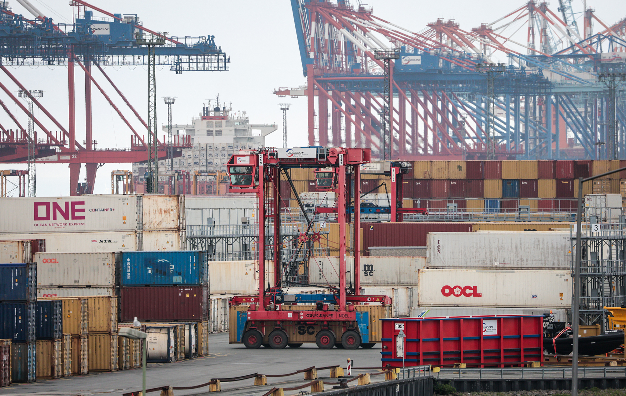 A van carrier of terminal operator Eurogate passes between stacked containers at the container terminal of Port Bremerhaven, Germany, April 22, 2025. /VCG