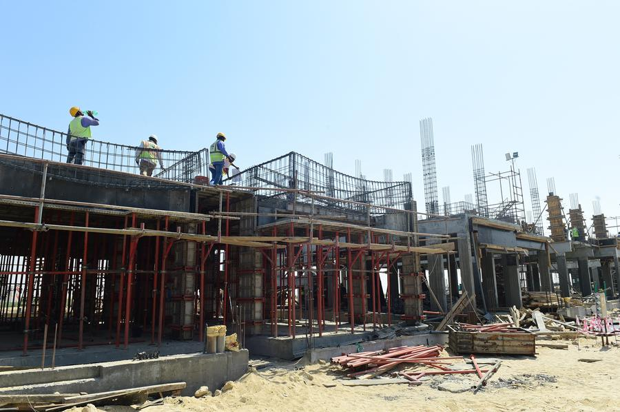 Workers work at the construction site of a housing project undertaken by Chinese enterprises in Ahmadi Governorate, Kuwait, August 6, 2023. /Xinhua