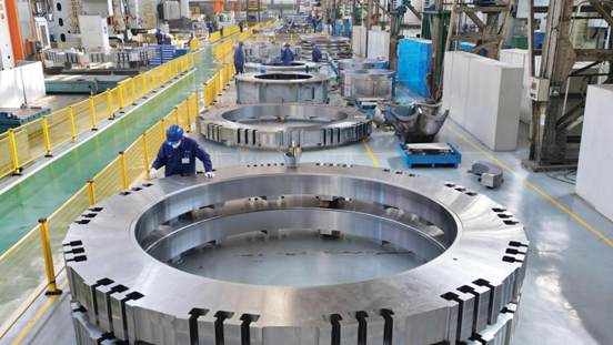 In this aerial drone photo, staff work at a factory of Harbin Electric Machinery Company Limited under Harbin Electric Corporation in Harbin, northeast China's Heilongjiang Province, April 16, 2025. /Xinhua