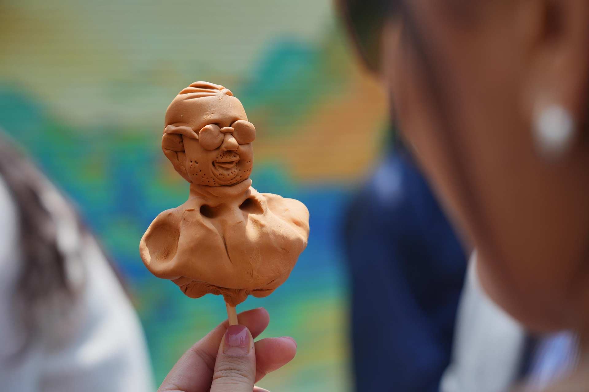 A clay sculpture is seen at a neighborhood festival held recently in Beijing's Chaoyang District. /Photo provided to CGTN
