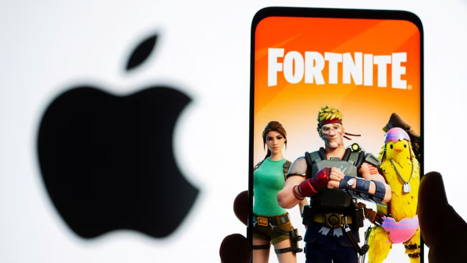 Fortnite game graphic is displayed on a smartphone in front of Apple logo in this illustration created, May 2, 2021. /Reuters