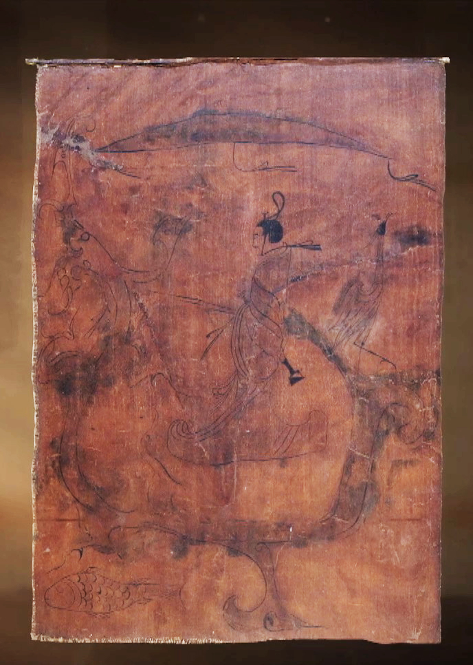 The silk painting uncovered during a later excavation at Zidanku in 1973 depicts a man riding a dragon. /CMG