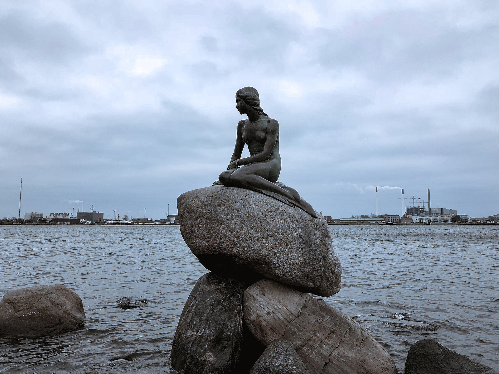 The Little Mermaid statue is seen sitting on a rock by the waterfront of Copenhagen, Denmark. /VCG