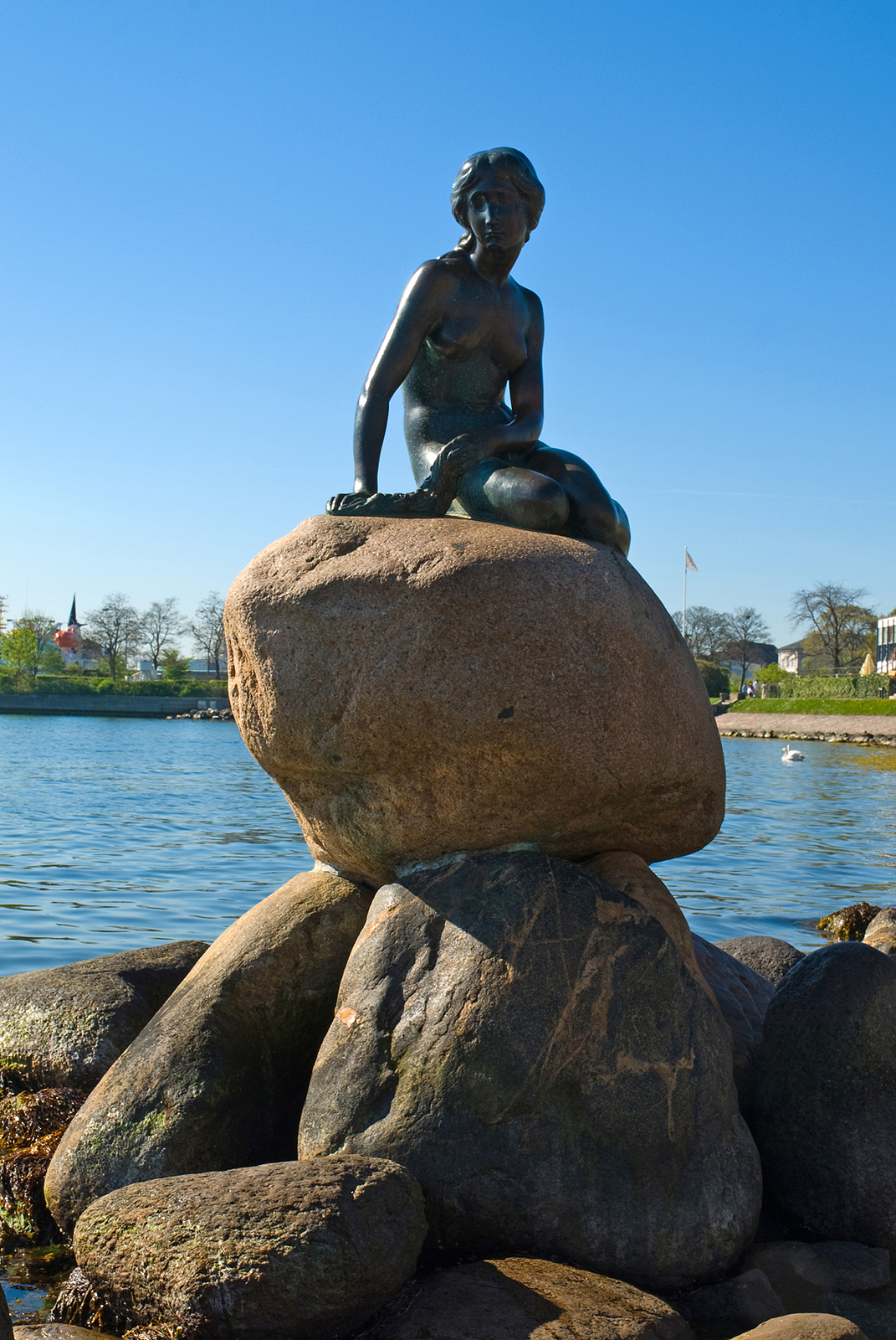 The Little Mermaid statue is seen sitting on a rock by the waterfront of Copenhagen, Denmark. /VCG