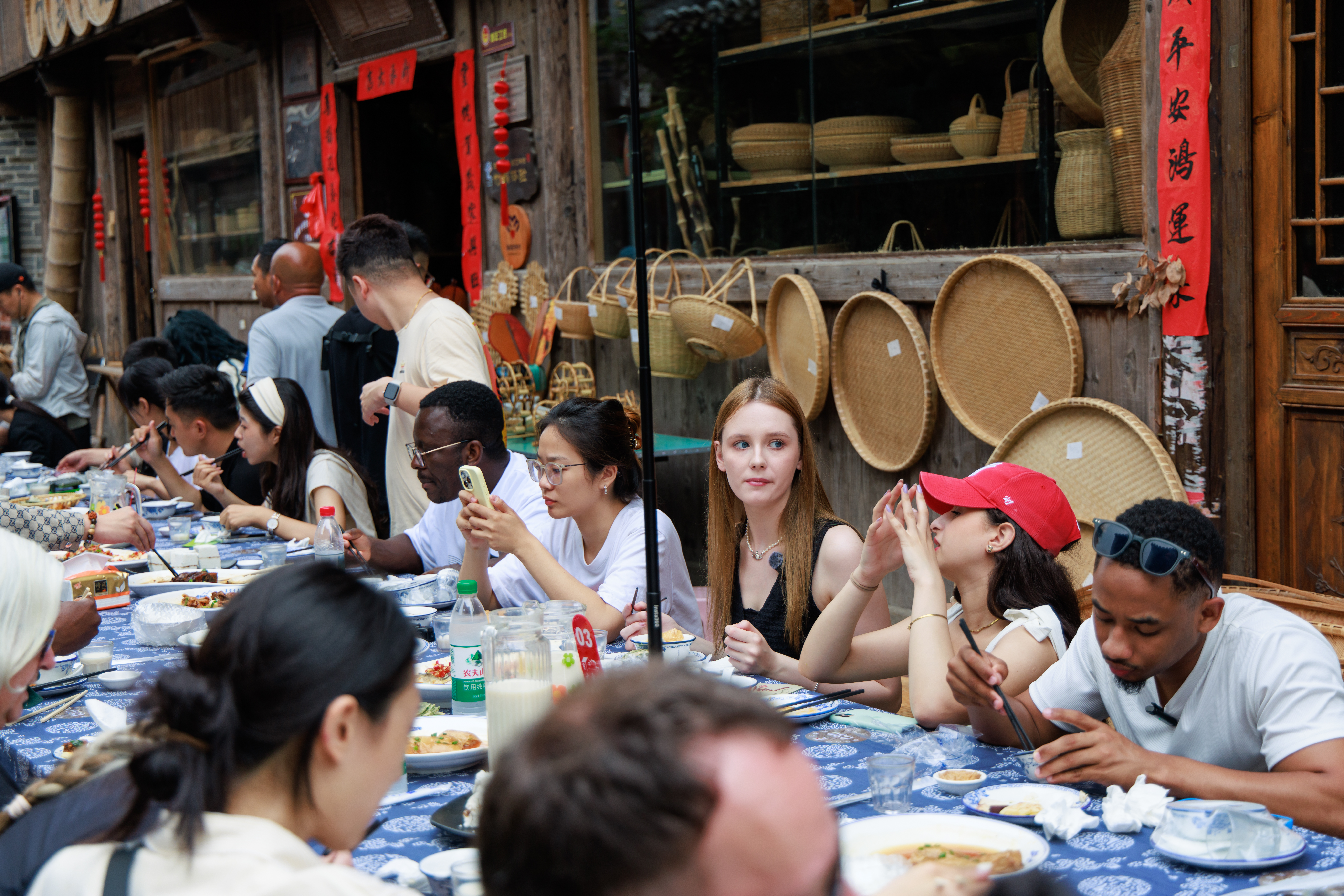 Visitors enjoy a long-table banquet at Qiantong Ancient Town in Ningbo, Zhejiang Province on May 18, 2025. / Photo provided to CGTN by Publicity Department of Ninghai County Committee