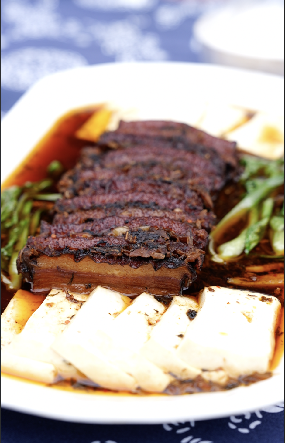 Chinese cuisine adorns the long-table banquet at Qiantong Ancient Town in Ningbo, Zhejiang Province on May 18, 2025. / Photo provided to CGTN by International Communication Center of Ningbo Media Group