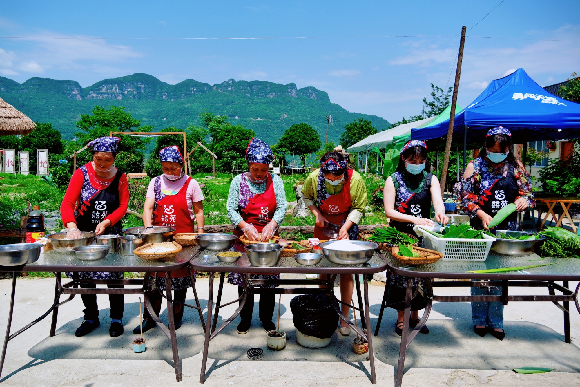 People make traditional zongzi in Sinan County, southwest China's Guizhou Province, on May 20, 2025. /Photo provided to CGTN