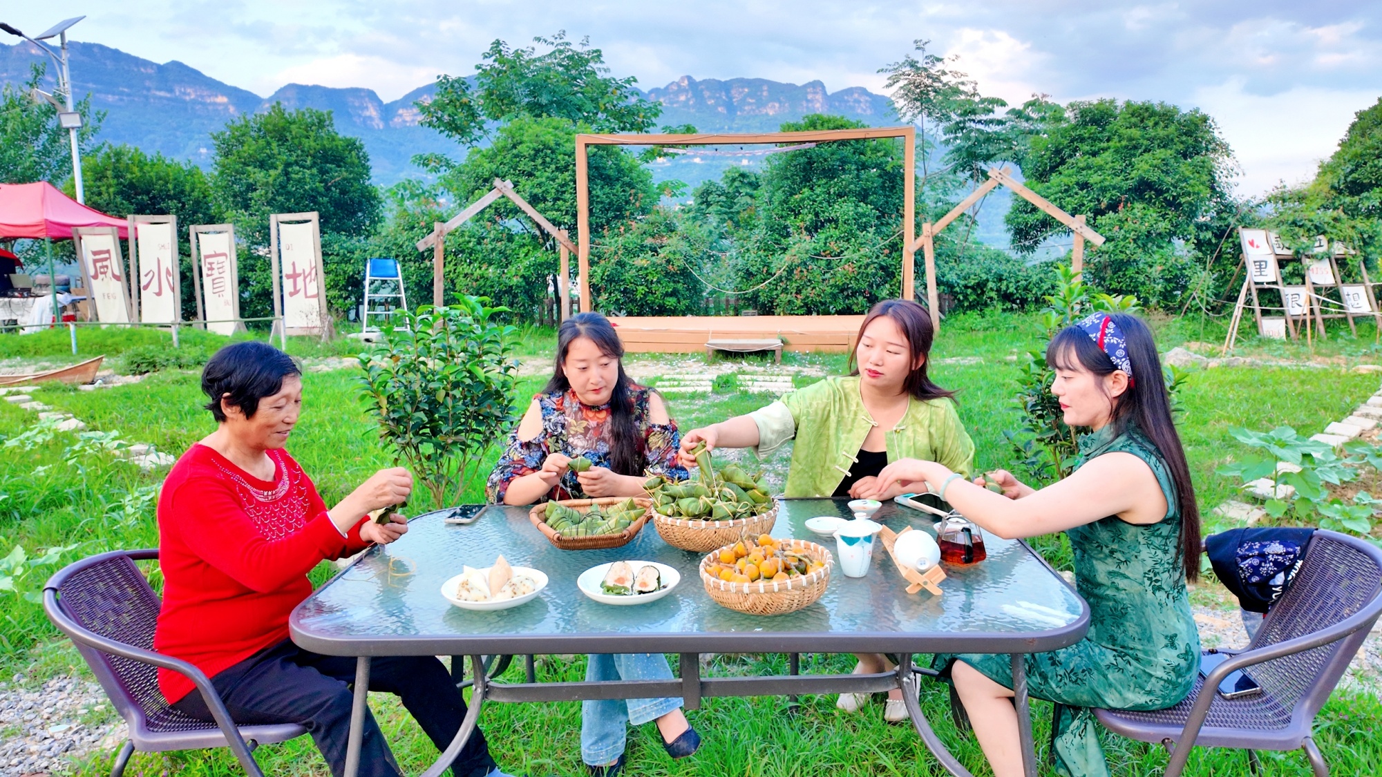 People enjoy traditional handmade zongzi in Sinan County, southwest China's Guizhou Province, on May 20, 2025. /Photo provided to CGTN