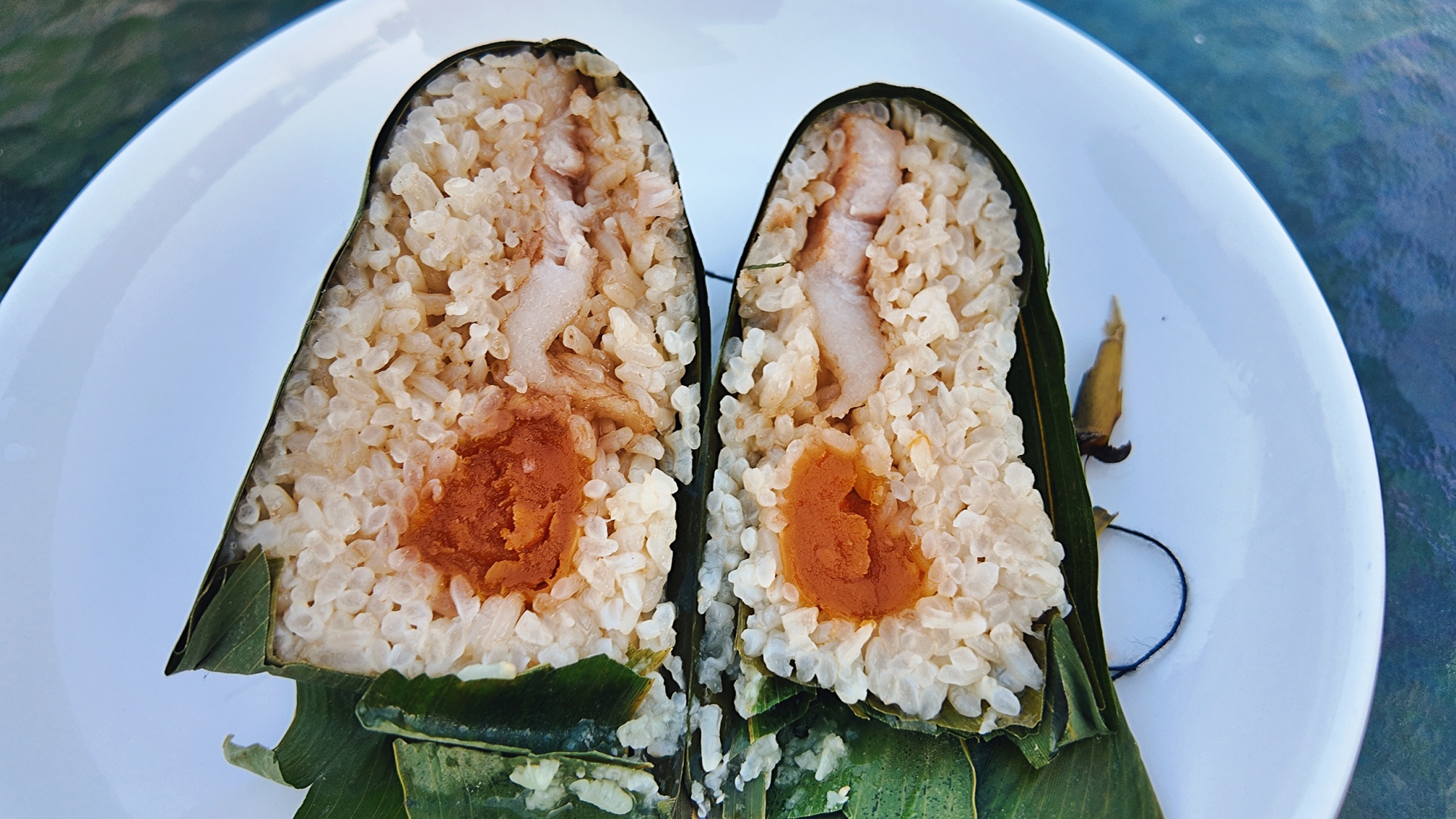 A traditional handmade zongzi is seen in Sinan County, southwest China's Guizhou Province, on May 20, 2025. /Photo provided to CGTN