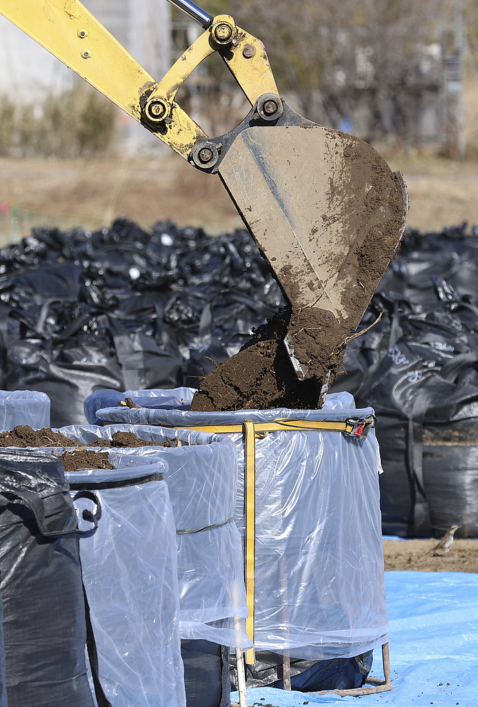 Flexible container bags of surface soil removed during decontamination work are pictured in a designated residence return zone in Okuma Town, Fukushima Prefecture, Japan, February 13, 2024. /CFP