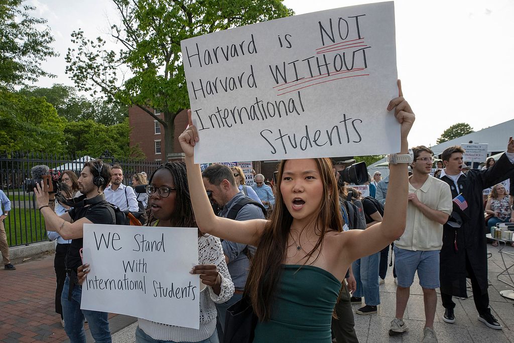People hold up signs during the Harvard Students for Freedom rally in support of international students at the Harvard University campus in Boston, Massachusetts, the U.S., May 27, 2025. /CFP