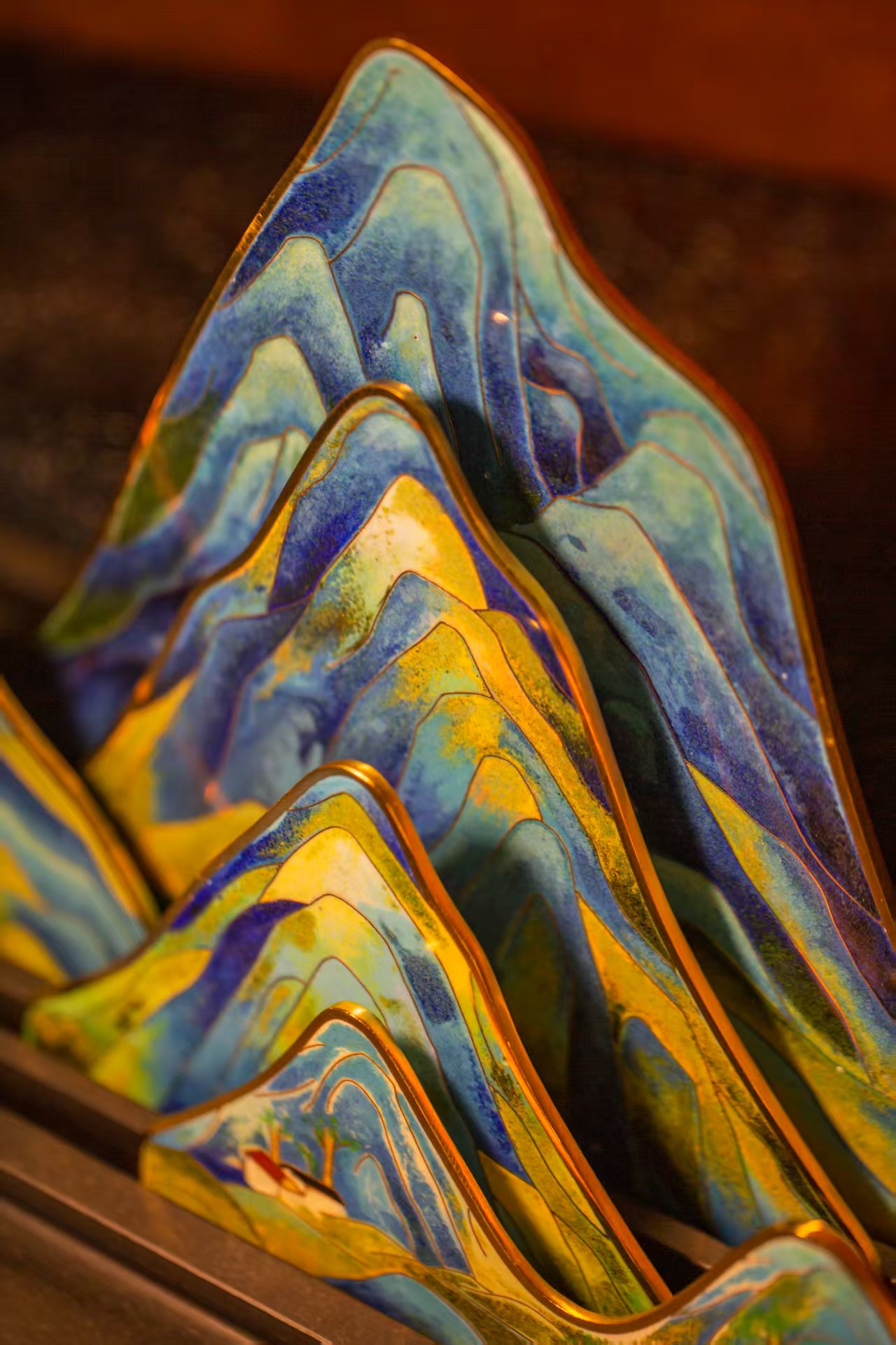 This article features a close-up of a distinctive tea table that also functions as an incense burner. It was crafted by cloisonné master artisan Zhu Jingyou and was presented here just days ahead of China's Cultural and Natural Heritage Day on June 14, 2025. /Photo provided to CGTN