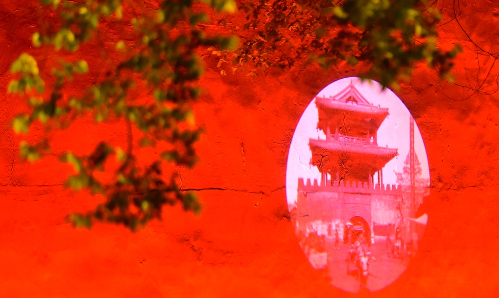 Projections are cast onto the red walls of the Shenyang Palace in Liaoning Province on June 16, 2025. /IC