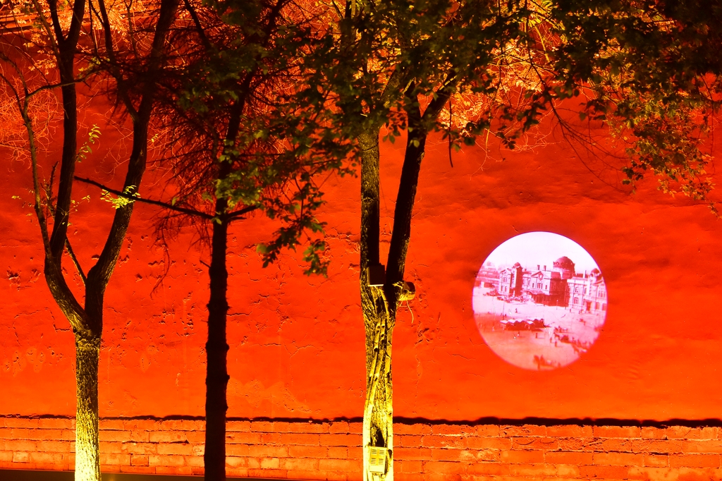 Projections are cast onto the red walls of the Shenyang Palace in Liaoning Province on June 16, 2025. /IC