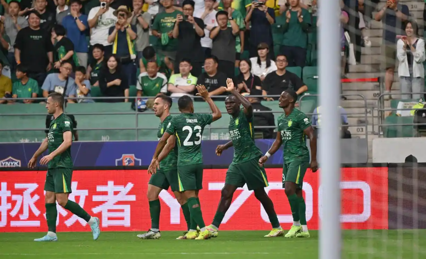 Beijing Guoan players celebrate after Qingdao West Coast goalkeeper Li Hao knocks in an own goal in a Chinese Super League (CSL) match in Beijing, June 17, 2025. /Xinhua