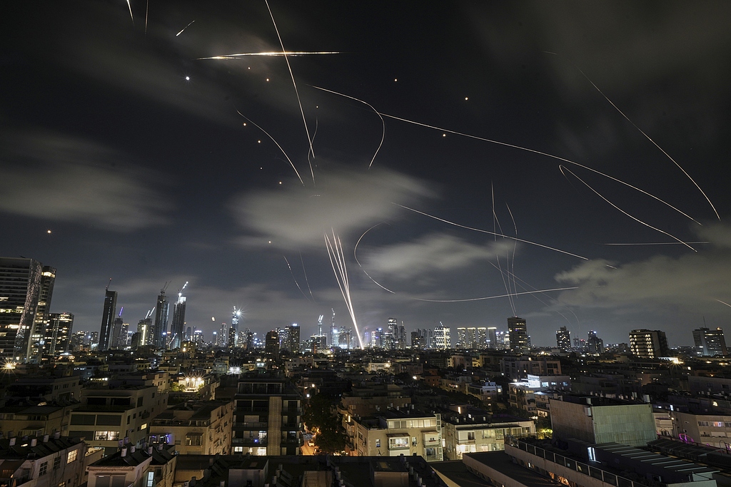 The Israeli Iron Dome air defense system fires to intercept missiles during an Iranian attack over Tel Aviv, Israel, June 18, 2025. /VCG