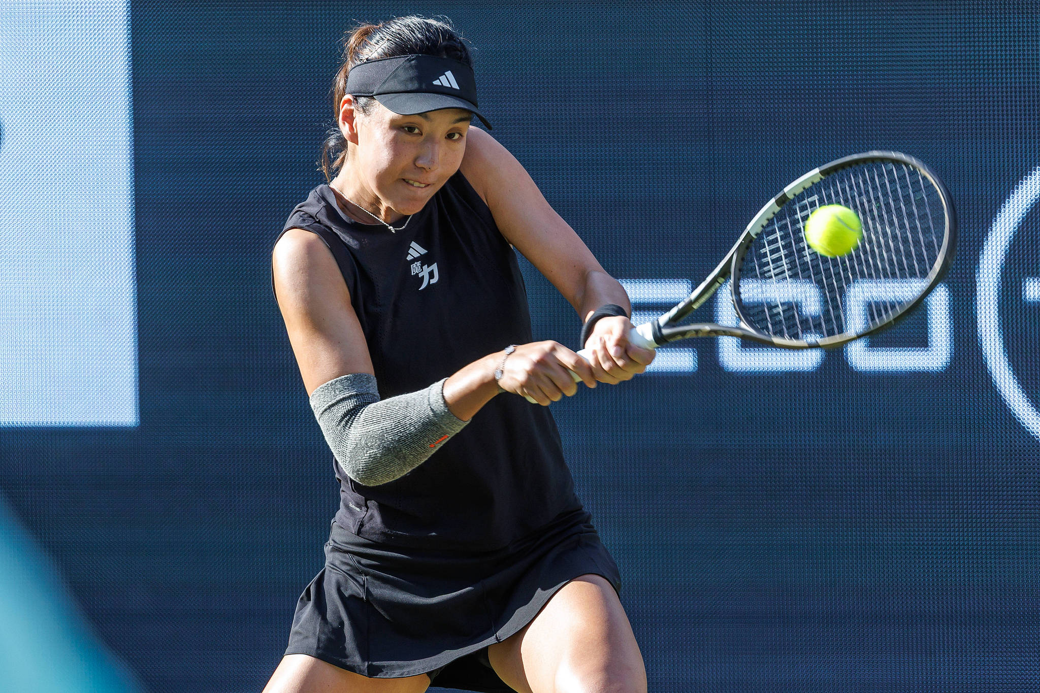 Wang Xinyu of China hits a shot against Coco Gauff of the USA in a women's singles round of 16 match at the WTA Berlin Open in Berlin, Germany, June 19, 2025. /VCG