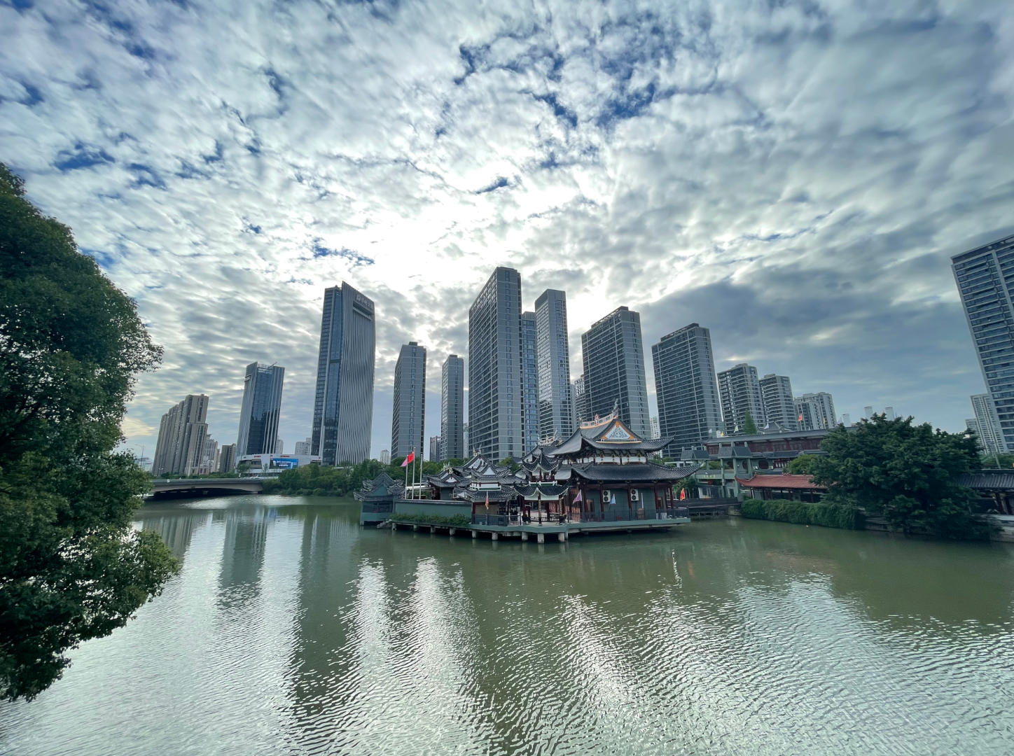 Old and new buildings along the banks of one of the many canals and rivers that criss-cross through Wenzhou, the 