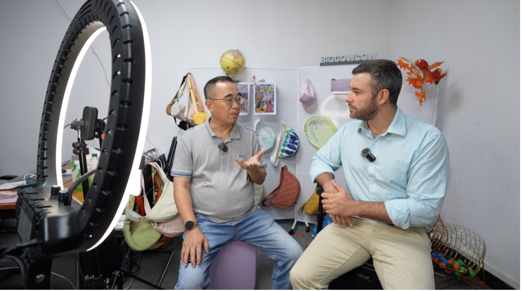 Zhang Xuanhao, Chairman of Guangzhou Huitong Industrial Group Co., Ltd., talks with CGTN host Lincoln Humphries, in Guangzhou City, Guangdong Province, May 23, 2025. /CGTN
