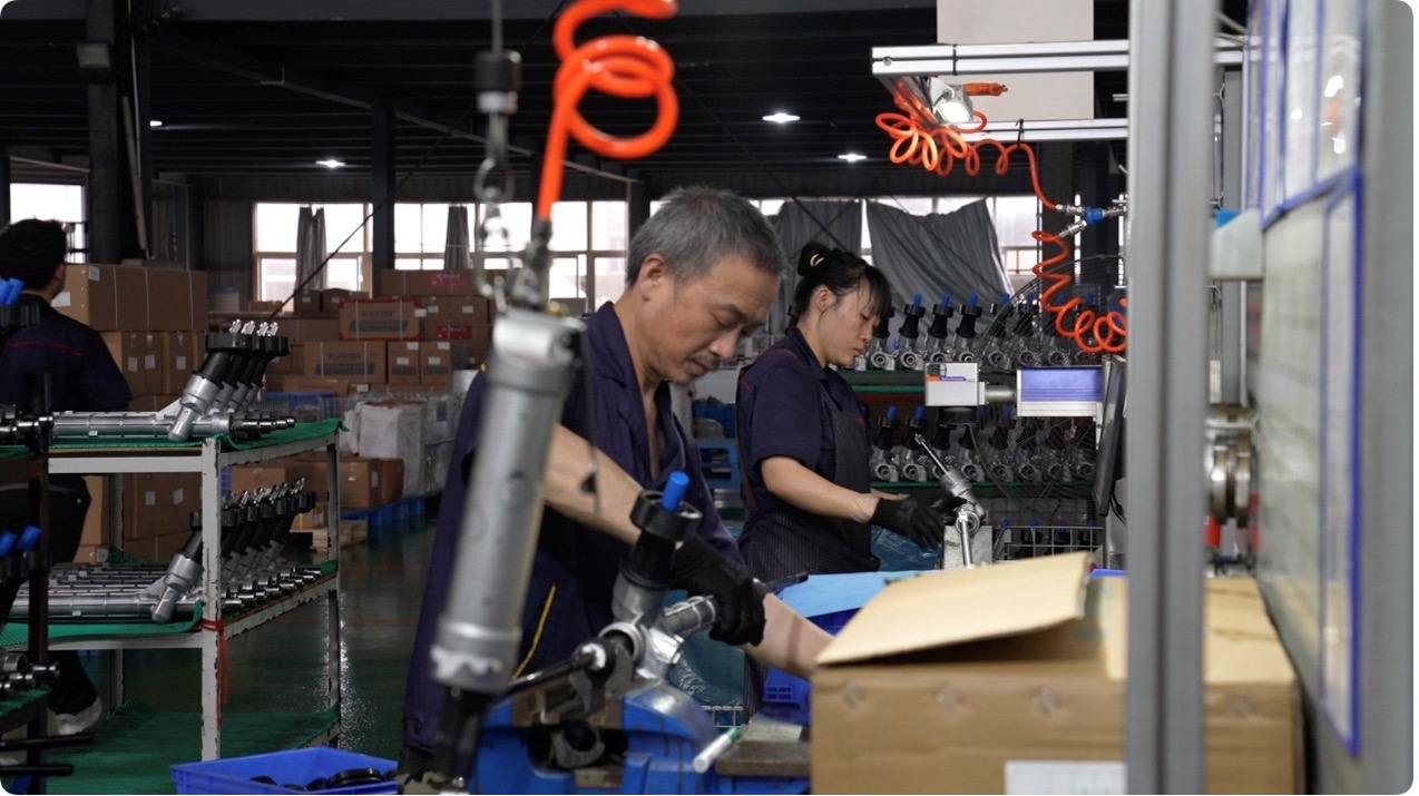 Employees working at the workshop of Guanrun Automobile Steering System Co., Ltd, in Huangshan City, Anhui Province, May 20, 2025. /CGTN